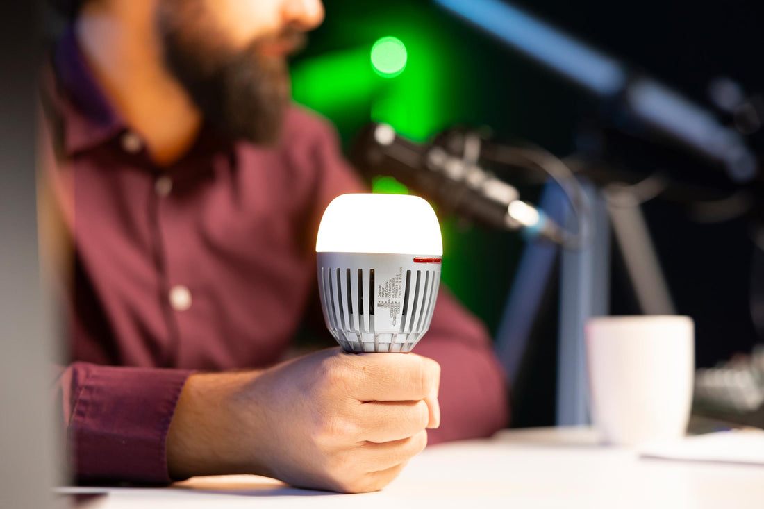 Alexa light bulbs hero image with smart lighting and Echo Dot in bedroom